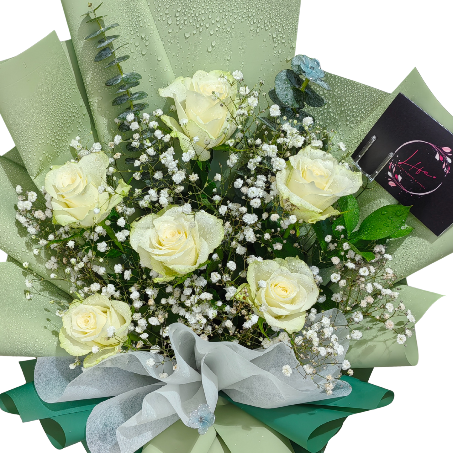 Close up view of "Mint to Be" bouquet of six white roses.