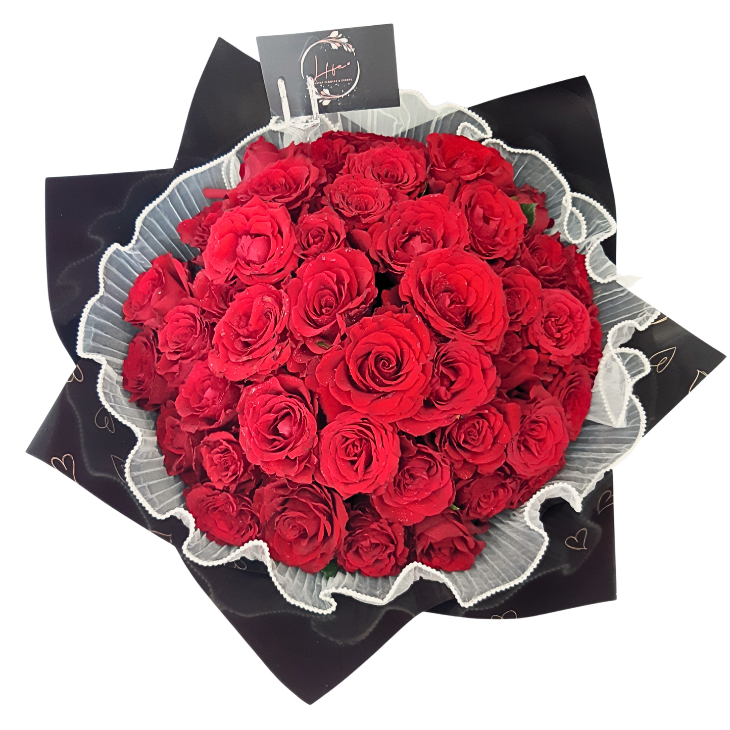 Top view of Ravishing Red - a compact bouquet of bright, 50 long-stem red roses.