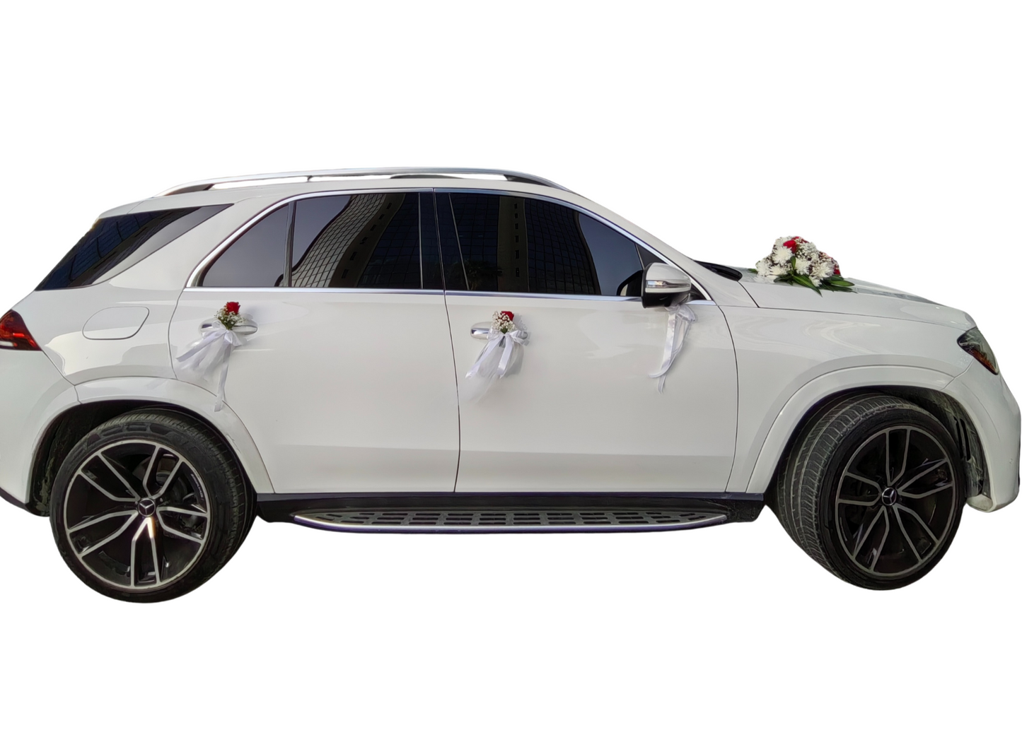 White luxury bridal car with elegant door embellishments and floral design.