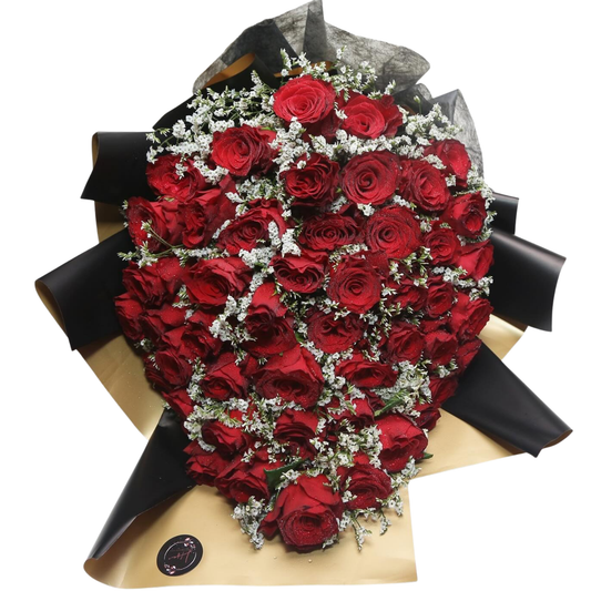 Luxury bouquet of 50 red roses with white statice, wrapped in elegant black and gold paper with ribbon— perfect for romantic gifting in Dubai.